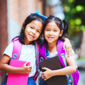 two female kids hugging