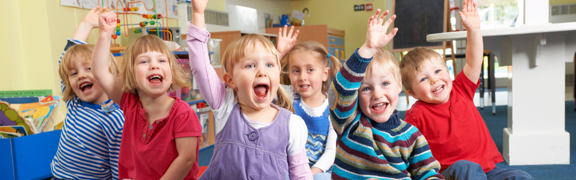 kids raising their hands